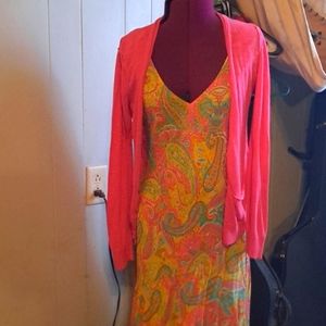 A beautiful multicolor spring dress by Ralph Lauren paired with a pink sweater.